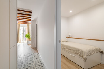 Stylish white corridor and bedroom of modern apartment