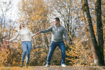 A young couple enjoying time together in autumn outdoors