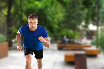 Cheerful and successful man jogging outdoor