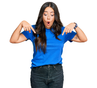Beautiful brunette young woman wearing casual clothes pointing down with fingers showing advertisement, surprised face and open mouth