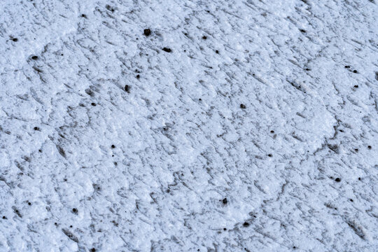 Textured Ice Surface with Embedded Debris