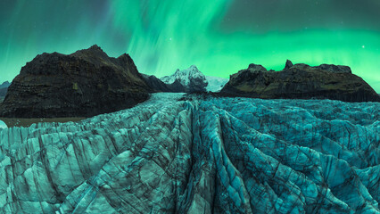Arctic glacier under the ethereal Northern Lights in Vatnajokull National Park, Iceland