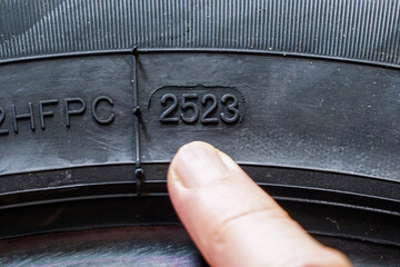 Tire side view with indication of the week and year of tire manufacture, production date marking