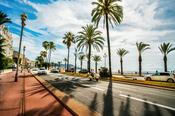 Amazing  Promenade des Anglais with fantastic palm trees, auto road  along coastline of Nice beach