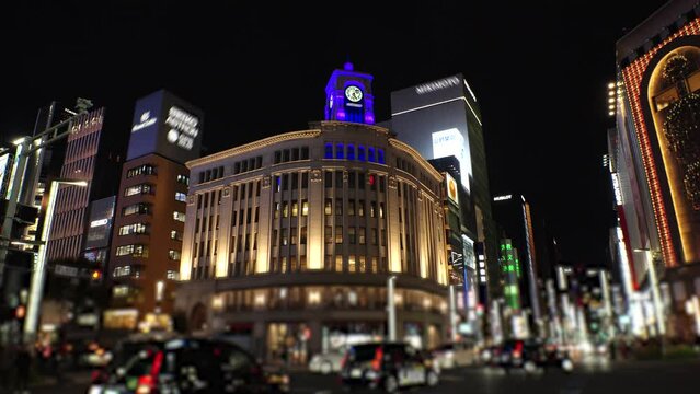 GINZA, TOKYO, JAPAN - NOV 2023 : View of Ginza area at night. Famous upmarket shopping, dining and entertainment district, featuring numerous department stores, restaurants, night clubs and cafes.