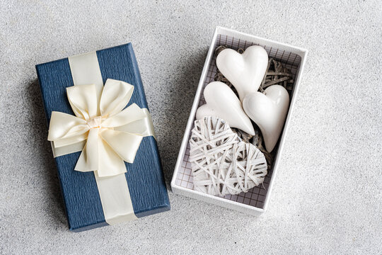 Blue Gift Box with Heart Ornaments Generative AI