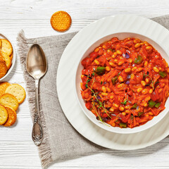chakalaka, spicy tomato bean relish in white bowl