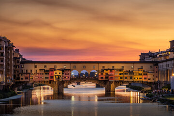 Florence, Italy - July 15, 2023: Ponte Vecchio bridge over Arno river in Florence, Italy - obrazy, fototapety, plakaty