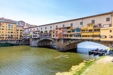 Fototapeta na wymiar Florence, Italy - July 15, 2023: Ponte Vecchio bridge over Arno river in Florence, Italy