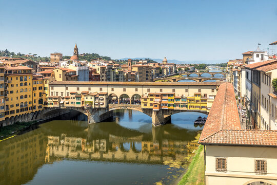 Florence, Italy - July 15, 2023: Ponte Vecchio bridge over Arno river in Florence, Italy