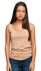 Obraz premium Beautiful hispanic woman wearing casual clothes depressed and worry for distress, crying angry and afraid. sad expression.