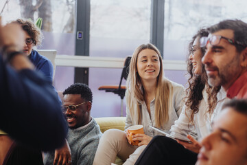 Multigenerational business team brainstorming for better efficiency and results in a modern corporate office. Collaborating, sharing ideas and working smart for company growth and profitability.