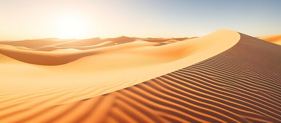 Curved sand patterns with sunlight and shadow on dunes, hot in summer under UV rays.