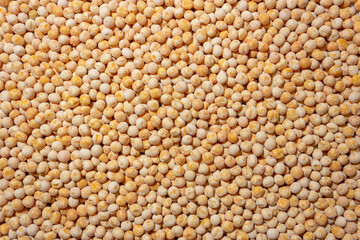 Uncooked Yellow Polished Peas Background. A Culinary Canvas of Dry Yellow Peas, Creating a Lively and Textured Background for Gourmet Cooking. Scattered Raw Polished Peas. Healthy Eating Ingredients