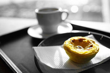 Portuguese Pastel de Nata snack with a coffee background