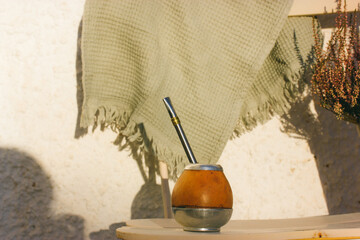 Mate calabash with bombilla. Healthy infused drink, classic Yerba mate tea on a table. Hot beverage...