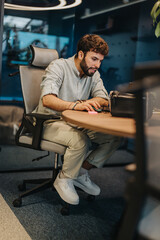 Focused Business Professional Conducting Online Research in Modern Office Environment