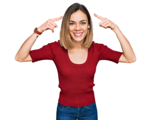 Young blonde girl wearing casual clothes smiling pointing to head with both hands finger, great idea or thought, good memory