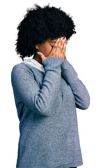 Young african american woman wearing business clothes with sad expression covering face with hands...