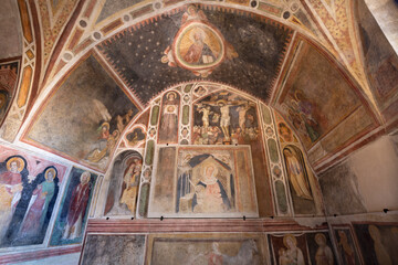 Fototapeta na wymiar TREVISO, ITALY - NOVEMBER 8, 2023: The frescoes in the church Chiesa di San VIto e Santa Lucia by Tomaso da Modena from first half of 14. cent. 