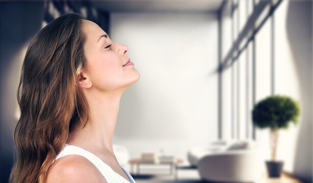 profile face of beautiful young woman breathing fresh air