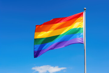 Pride Flag Waving Against Clear Blue Sky