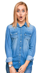 Beautiful caucasian woman wearing casual denim jacket afraid and shocked with surprise expression, fear and excited face.