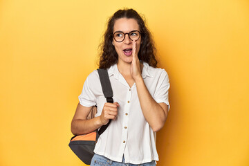 Caucasian university student with glasses, backpack, is saying a secret hot braking news and...