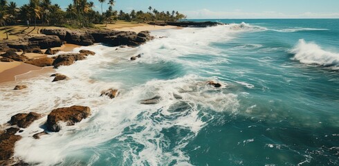 Nature's symphony plays as the wind and tide dance, creating a picturesque landscape of crashing waves against rocky shores on a tropical beach