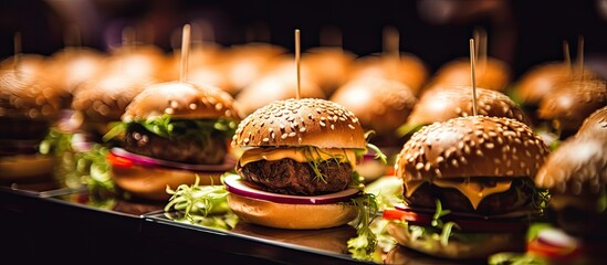 Mini hamburgers at catering event, in close view.