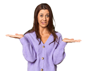 Elegant middle-aged Caucasian woman in studio setting confused and doubtful shrugging shoulders to hold a copy space.