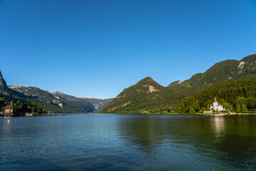 Stunning panorama view of Grundlsee lake with peaks of Styrian Alps in background on a sunny summer day, Styria, Austria - 688839090