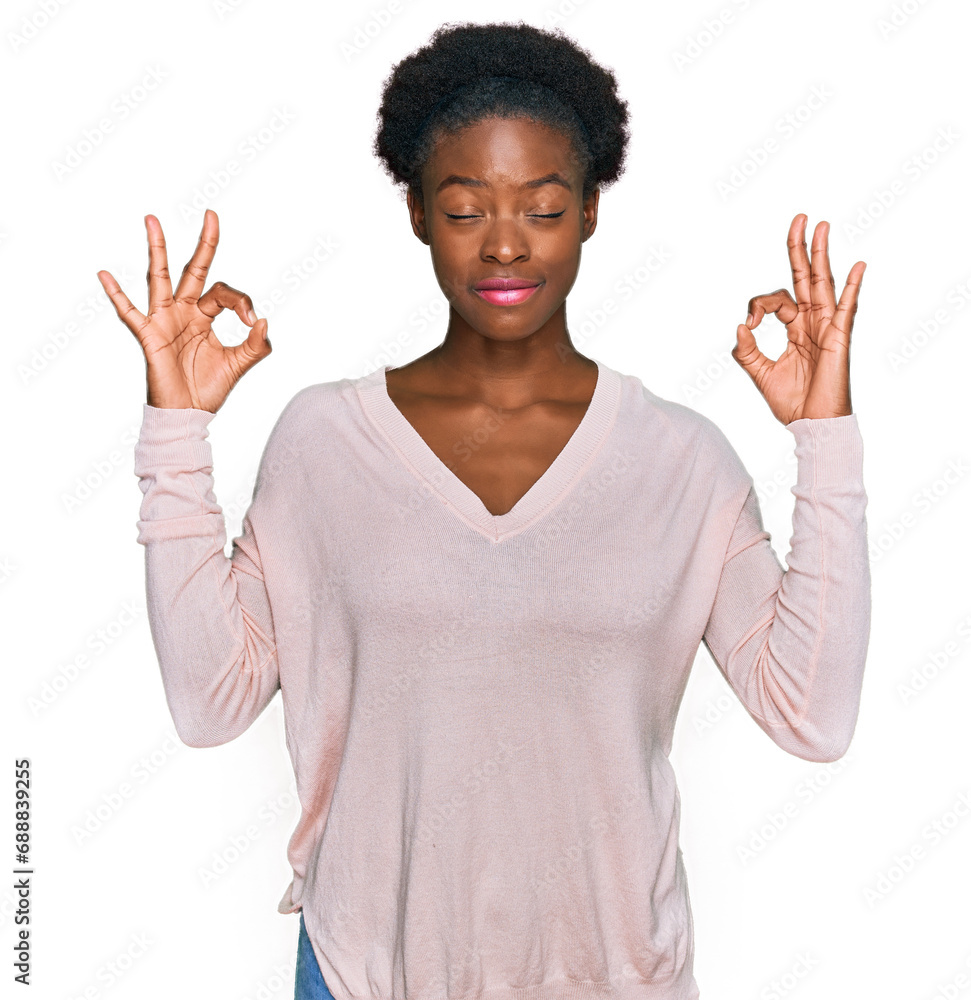 Poster Young african american girl wearing casual clothes relaxed and smiling with eyes closed doing meditation gesture with fingers. yoga concept.