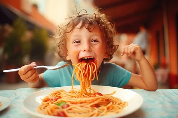 Fotobehang Cute Young Boy Eating a Plate of Spaghetti © JJAVA