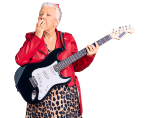 Senior beautiful woman with blue eyes and grey hair wearing a modern look playing electric guitar bored yawning tired covering mouth with hand. restless and sleepiness.