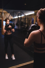 Young Female Boxing Training at Fitness Center