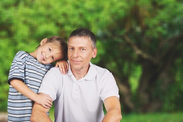 Playful father have fun with son in park