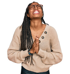 African american woman wearing casual clothes begging and praying with hands together with hope...