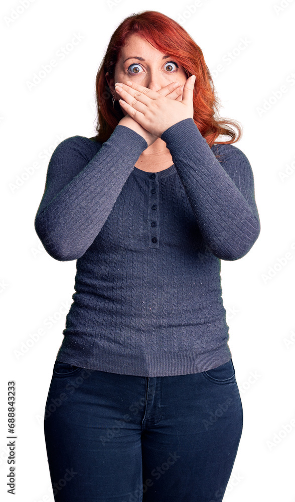 Canvas Prints Young beautiful redhead woman wearing casual t-shirt shocked covering mouth with hands for mistake. secret concept.