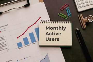 There is notebook with the word Monthly Active Users. It is as an eye-catching image.