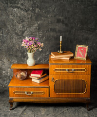 wooden vintage furniture and accessories on gray background