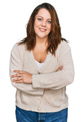 Young plus size woman wearing casual clothes happy face smiling with crossed arms looking at the camera. positive person.