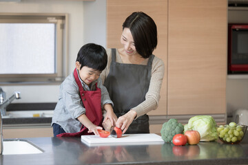 Parents and children having fun cooking in the kitchen together Helping children Copy space...