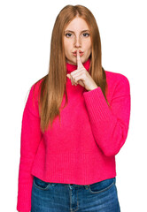 Young irish woman wearing casual clothes asking to be quiet with finger on lips. silence and secret...