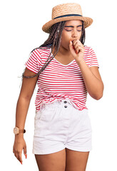 Young african american woman with braids wearing summer hat feeling unwell and coughing as symptom for cold or bronchitis. health care concept.