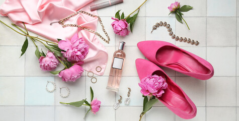 Composition with stylish female accessories, high heels shoes, cosmetics and peony flowers on light tile background
