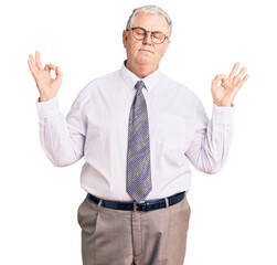 Senior grey-haired man wearing business clothes relax and smiling with eyes closed doing meditation gesture with fingers. yoga concept.