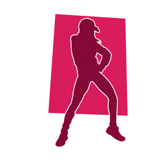 Silhouette of a slim female dance pose. Silhouette of a female in aerobic movement.