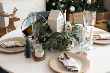 Festive table setting with Christmas decor at home