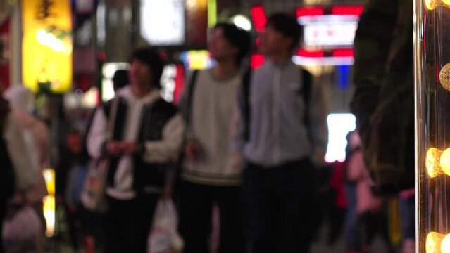 SHINJUKU, TOKYO, JAPAN - NOV 2023 : KABUKICHO downtown area at night. Colorful led neon street signs at entertainment district. Japanese urban nightlife and drinking concept video. Time lapse shot.
